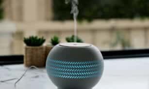 A bluetooth speaker sitting on top of a table