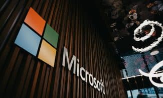 Interior view of Microsoft office with logo on wooden wall in Brussels, Belgium.