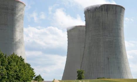 Cooling towers of Dukovany nuclear power plant with steam on a clear day.