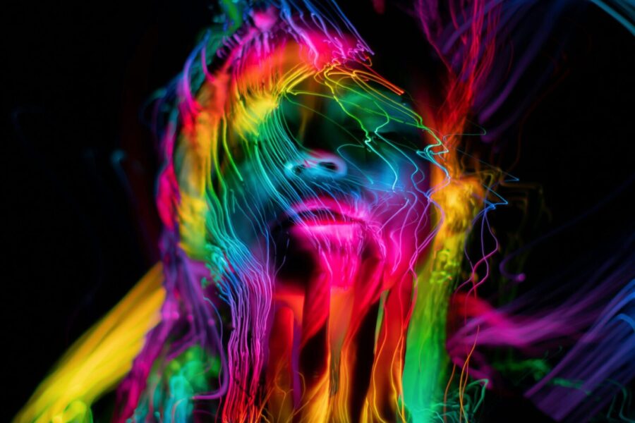 Colorful abstract neon portrait capturing luminescent waves and dynamic light.