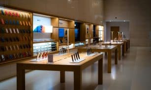 Sleek interior of a high-tech store showcasing various mobile devices and accessories.