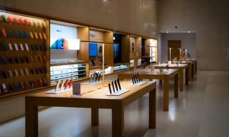 Sleek interior of a high-tech store showcasing various mobile devices and accessories.