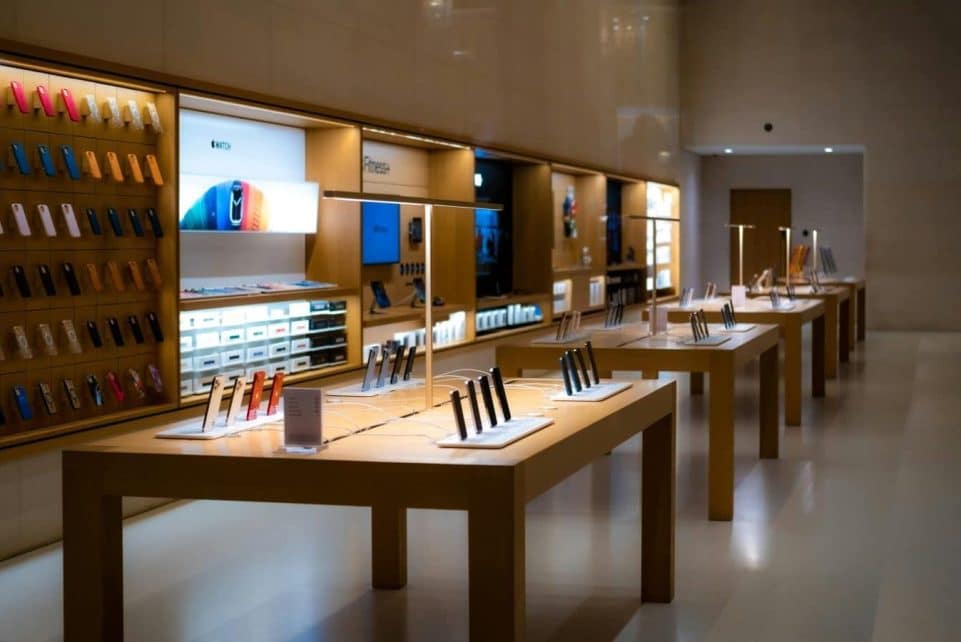 Sleek interior of a high-tech store showcasing various mobile devices and accessories.