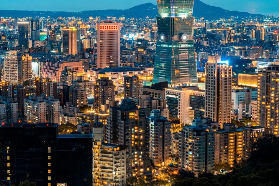 A striking view of the illuminated Taipei skyline featuring the iconic Taipei 101 tower.