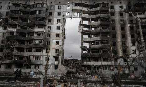 A destroyed apartment building in Borodyanka, Ukraine, showing aftermath of conflict.
