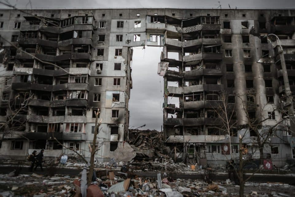 A destroyed apartment building in Borodyanka, Ukraine, showing aftermath of conflict.