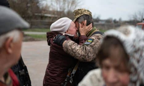 Heartfelt embrace in Makariv, Ukraine, capturing the emotional reunion.