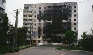 A heavily damaged apartment building in Borodyanka, Ukraine, illustrating urban devastation.