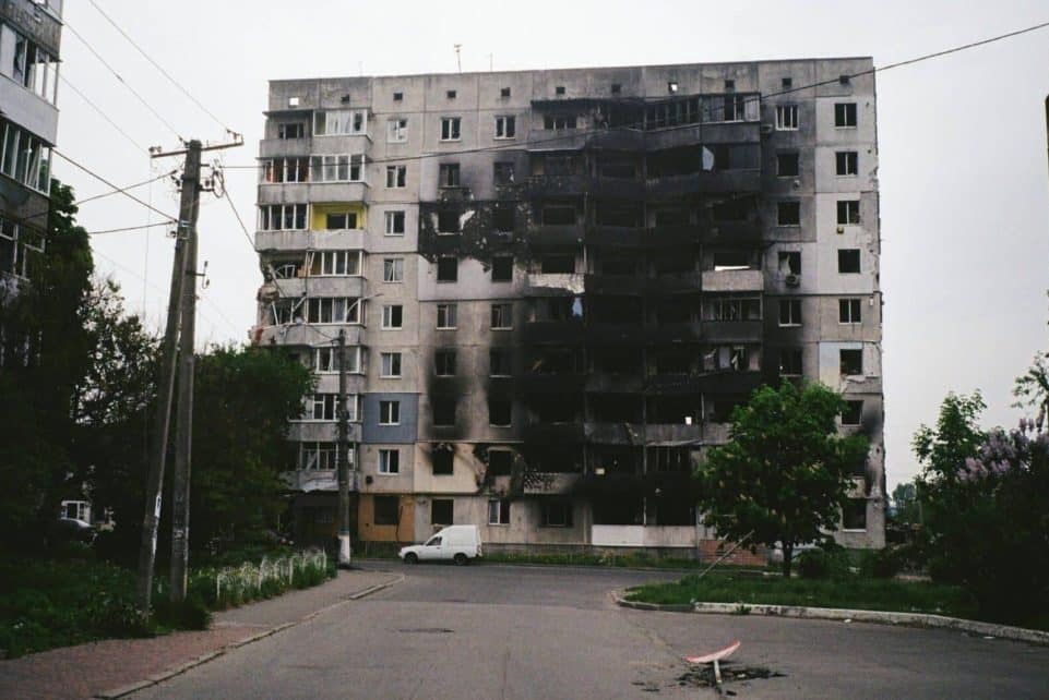 A heavily damaged apartment building in Borodyanka, Ukraine, illustrating urban devastation.