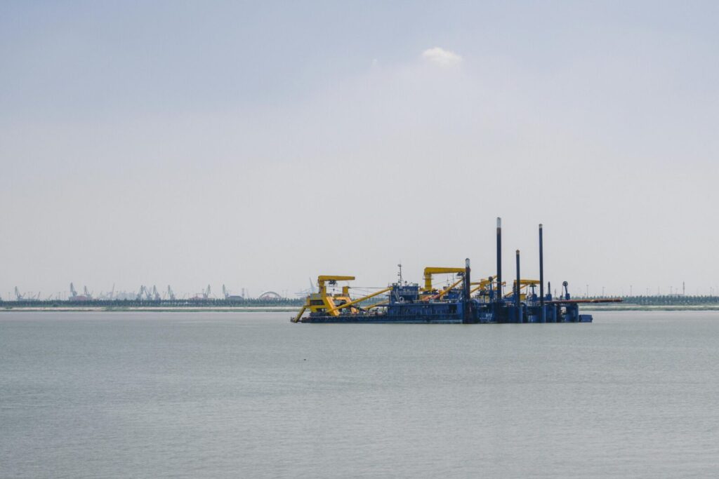 Oil platform in the sea under clear skies, showcasing industrial seascape.