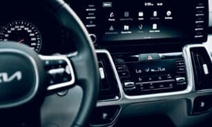 Close-up view of a luxury car's dashboard featuring a modern touchscreen display and advanced features.