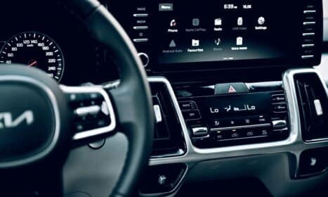 Close-up view of a luxury car's dashboard featuring a modern touchscreen display and advanced features.