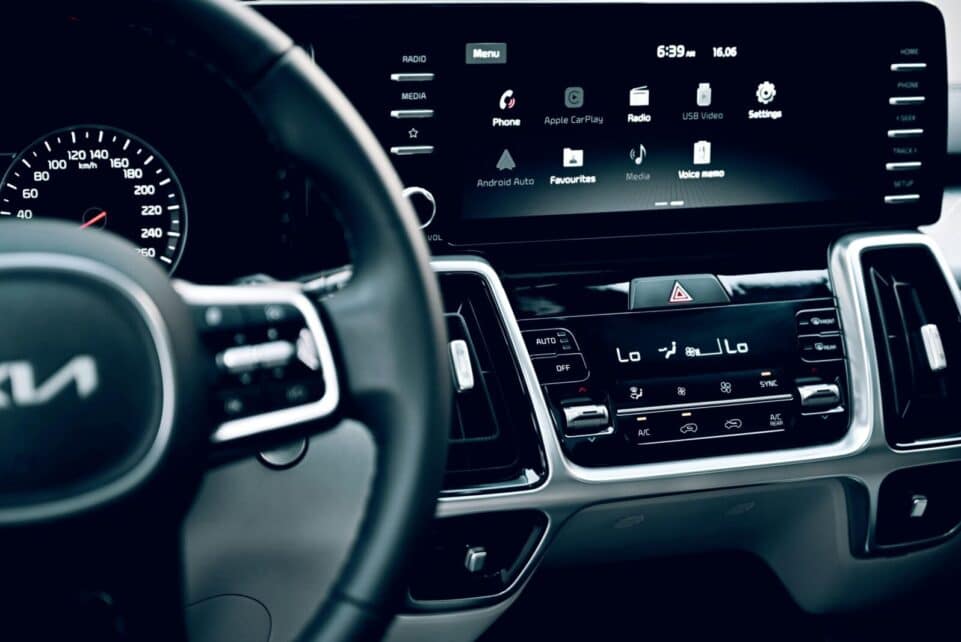 Close-up view of a luxury car's dashboard featuring a modern touchscreen display and advanced features.