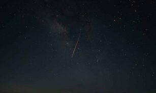 Beautiful night sky showcasing a shooting star against the Milky Way galaxy.