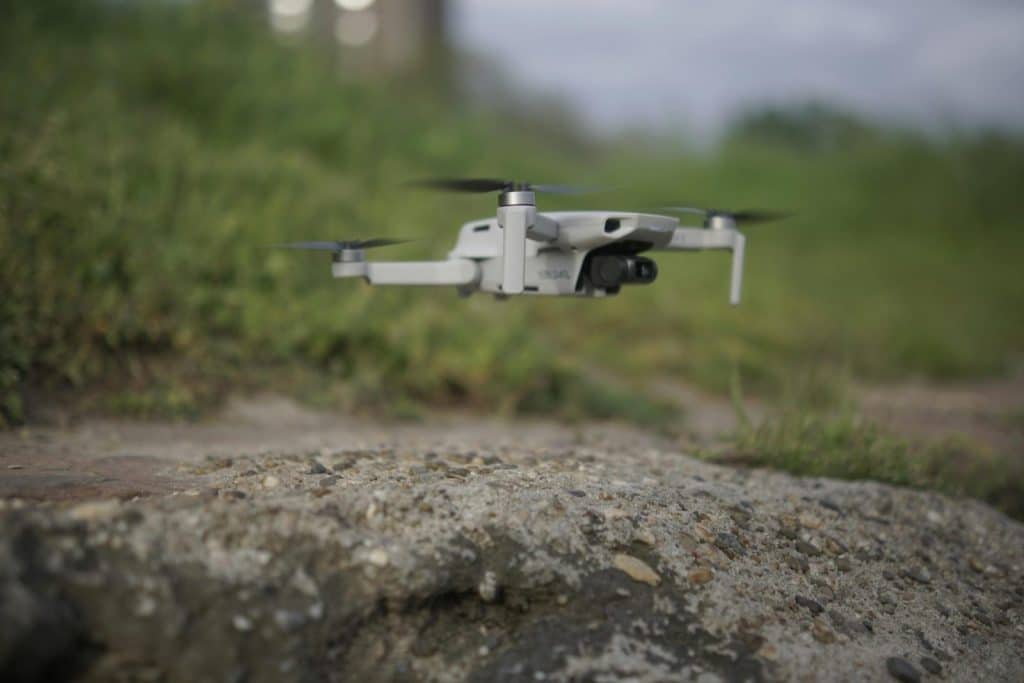 A close drone view of tech set against a rocky surface outdoors.