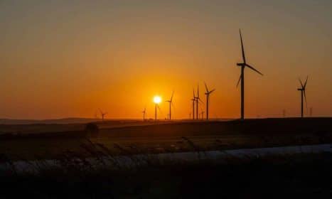 Beautiful sunset over a wind farm in Silivri, İstanbul, showcasing sustainable energy efforts.