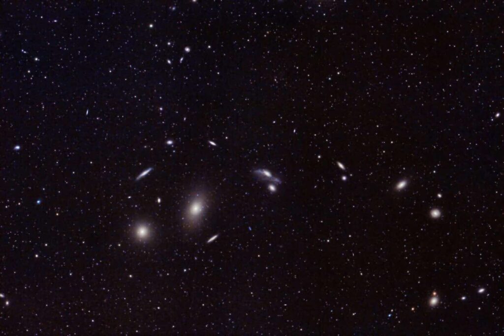 Captivating image of distant galaxies and star clusters in the vast universe. Perfect for astronomy enthusiasts.