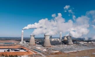 Aerial shot of an industrial power plant with smoke billowing in Euharlee, Georgia.