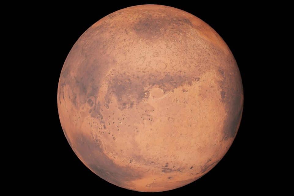 Detailed image of Mars highlighting surface features against a black space background.