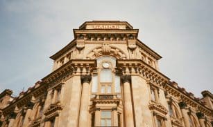 Ornate bank facade in Moscow featuring columns, windows, and architectural details.