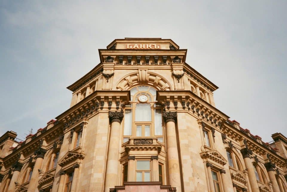 Ornate bank facade in Moscow featuring columns, windows, and architectural details.