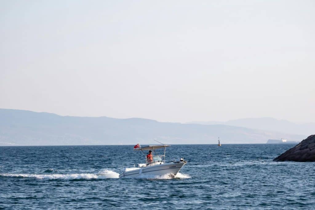 A peaceful boat journey on the clear sea near Foça, Türkiye, capturing the beauty of maritime travel.