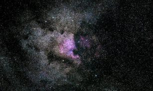 Captivating image of a vibrant nebula filled with stars in the expansive universe.