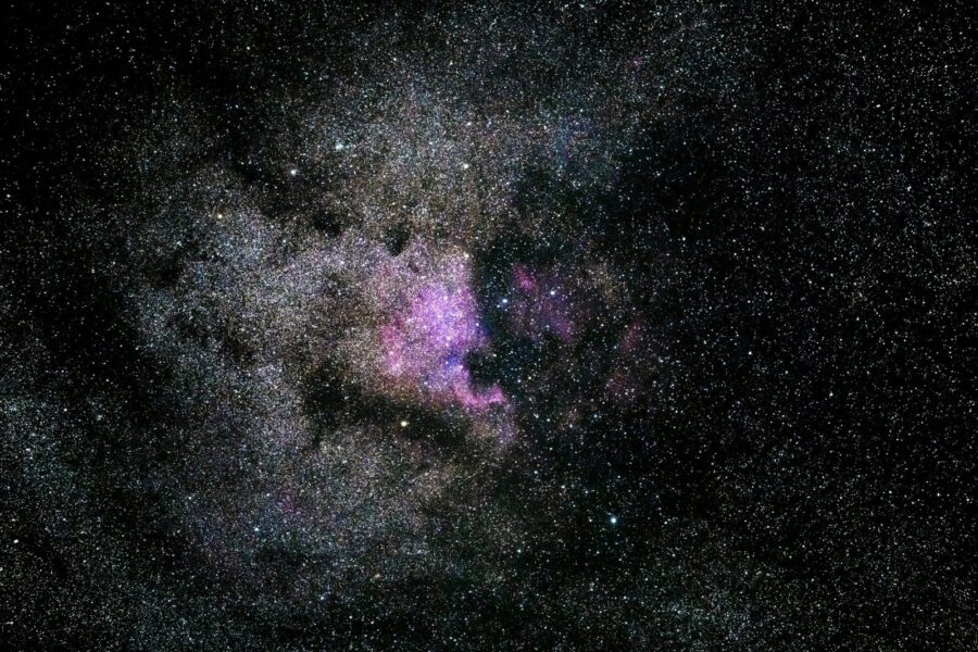 Captivating image of a vibrant nebula filled with stars in the expansive universe.