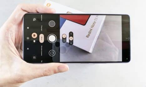 Close-up of a smartphone camera app focusing on a Redmi Note 13 Pro box.