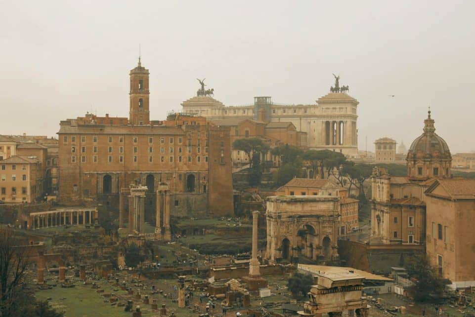 Panoramic view of ancient Roman ruins and historic architecture in Rome, Italy.