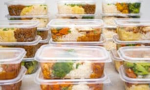 Multiple containers of prepared meals with rice and vegetables for easy meal management.