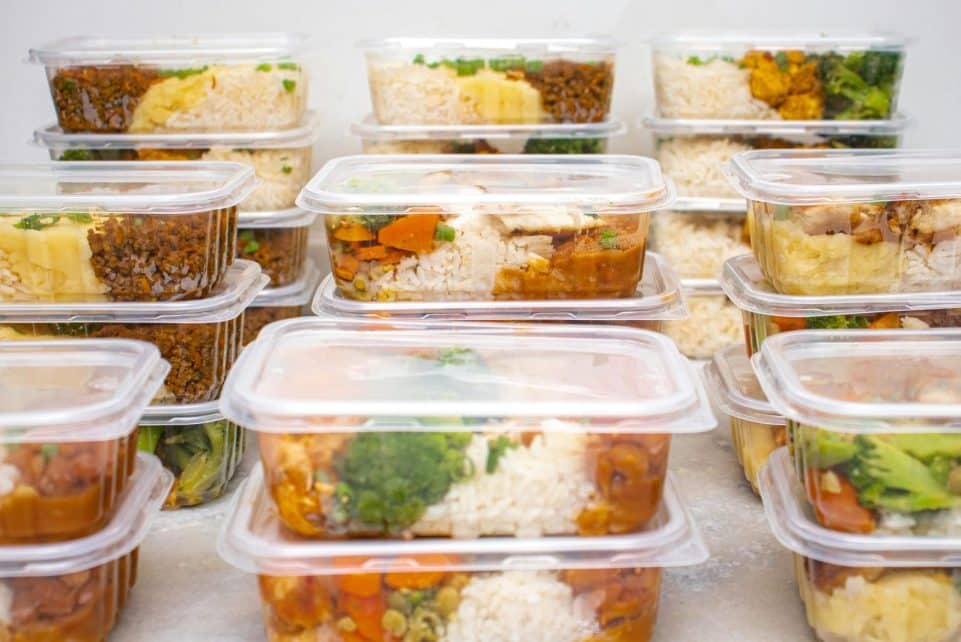 Multiple containers of prepared meals with rice and vegetables for easy meal management.