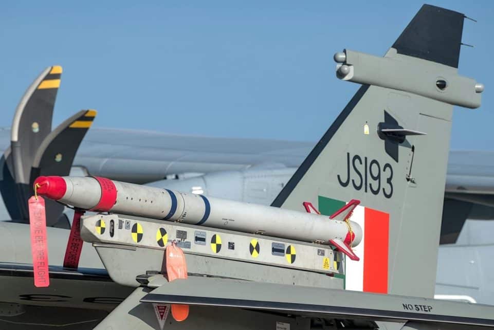 Aircraft tail with missile at Aero India in Bengaluru. Detailed close-up for aviation enthusiasts.