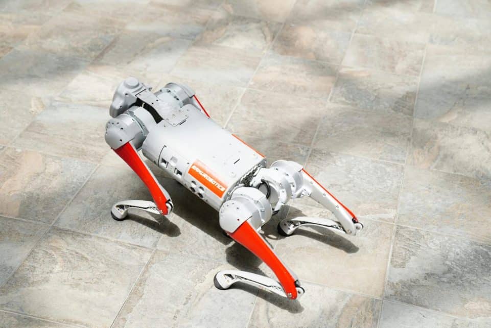 High-tech robotic dog on a tiled surface, showcasing cutting-edge robotics.
