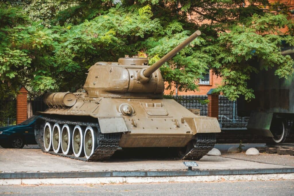A vintage tank exhibited outdoors showcases military history and heritage.