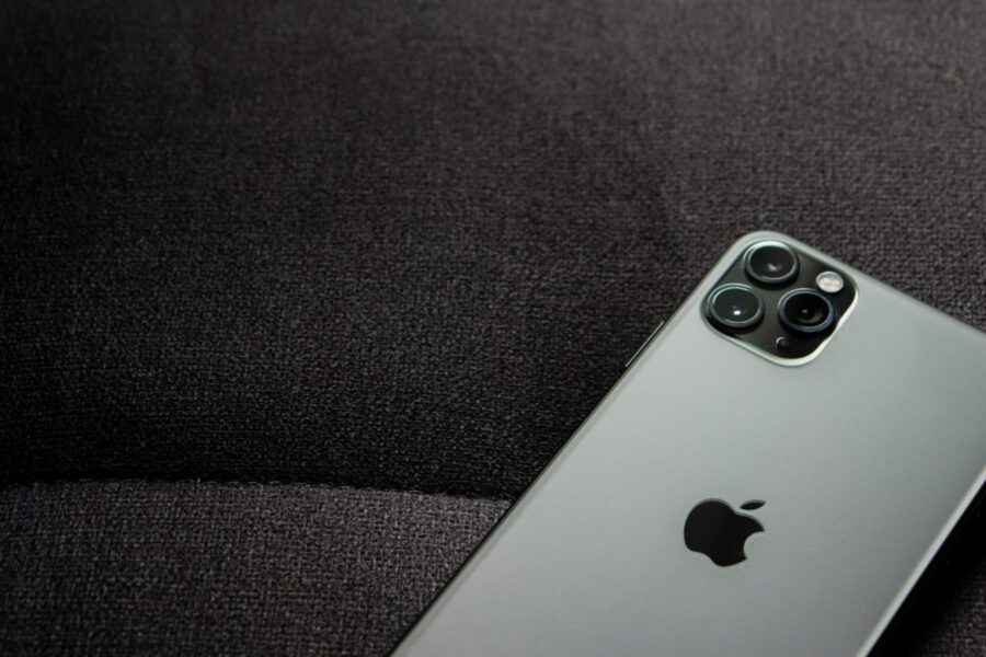 Close-up of a smartphone highlighting its modern design on a dark background.