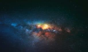 Breathtaking view of milky way on starry sky with bright glowing lights in dark space against black background in universe