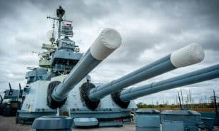Iconic USS North Carolina battleship with massive turrets in Wilmington, NC.