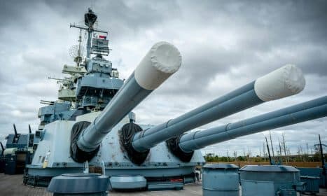 Iconic USS North Carolina battleship with massive turrets in Wilmington, NC.