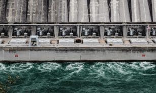 A stunning aerial view of the hydro power plant at Niagara Falls, showcasing engineering marvels and rushing water.