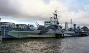 A striking view of HMS Belfast on the River Thames, showcasing naval heritage.