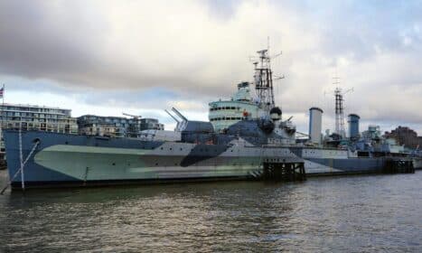 A striking view of HMS Belfast on the River Thames, showcasing naval heritage.
