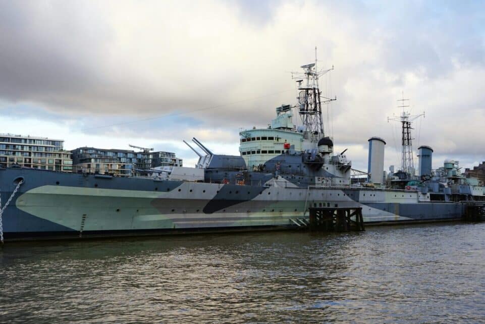 A striking view of HMS Belfast on the River Thames, showcasing naval heritage.