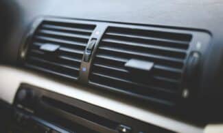 Detailed view of air conditioning vents in the interior of a BMW car, showcasing modern automotive design.