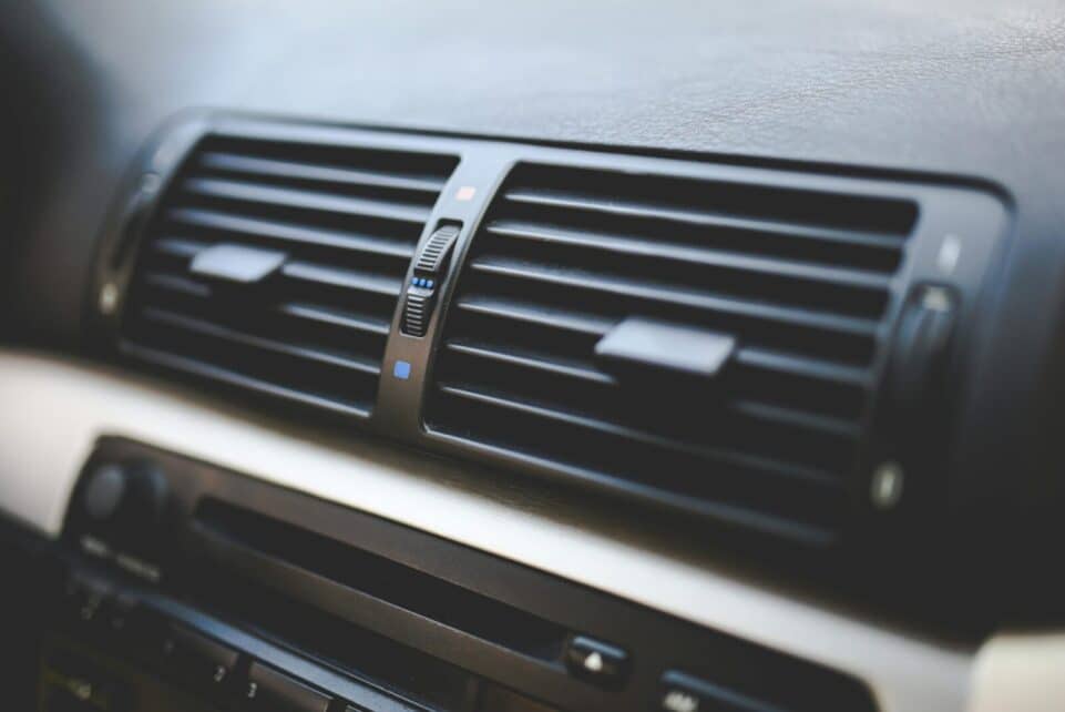 Detailed view of air conditioning vents in the interior of a BMW car, showcasing modern automotive design.
