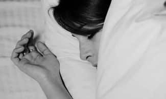 Close-up of a person sleeping peacefully, captured in monochrome for a serene feel.