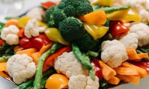 A vibrant assortment of fresh vegetables including broccoli, asparagus, and bell peppers.