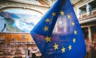 Close-up of the European Union flag inside the Swiss Parliament's National Council chamber in Bern.