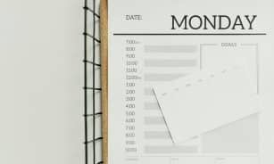 Top view of a minimalist schedule planner with Monday header. Perfect for organizing daily tasks with goals section.