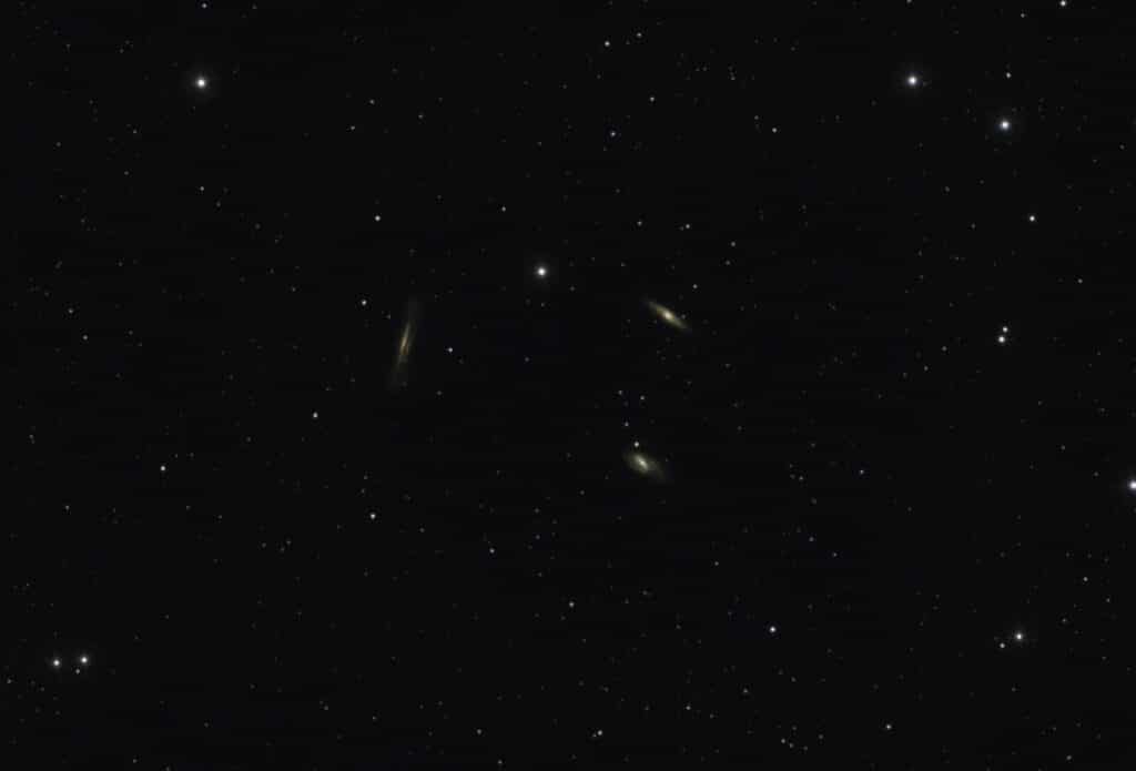 A breathtaking view of distant galaxies amidst a starry night sky filled with countless stars.